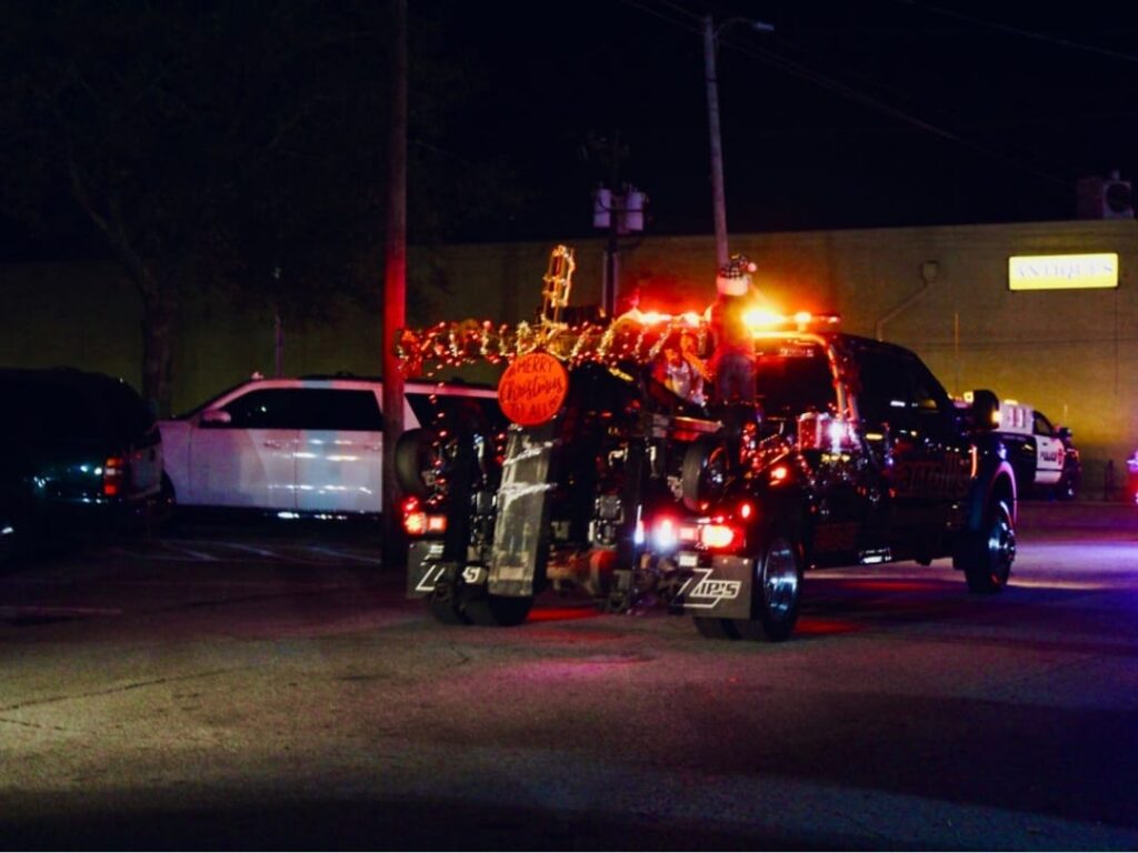 Accident towing service in Palestine TX with police and tow truck at night