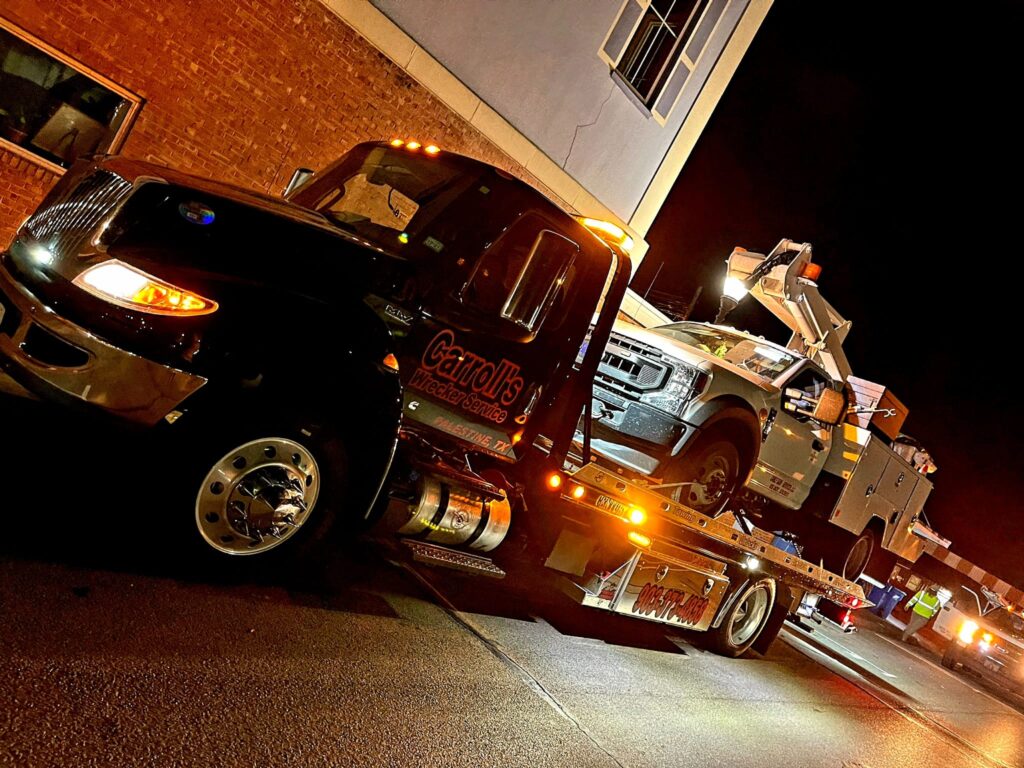 Emergency vehicle recovery and towing service at night in Palestine TX