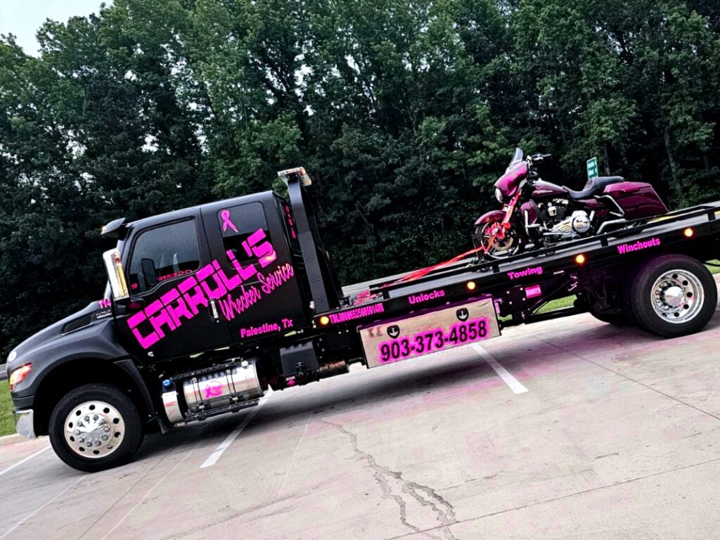 Specialty towing service in Palestine TX hauling ATV on flatbed