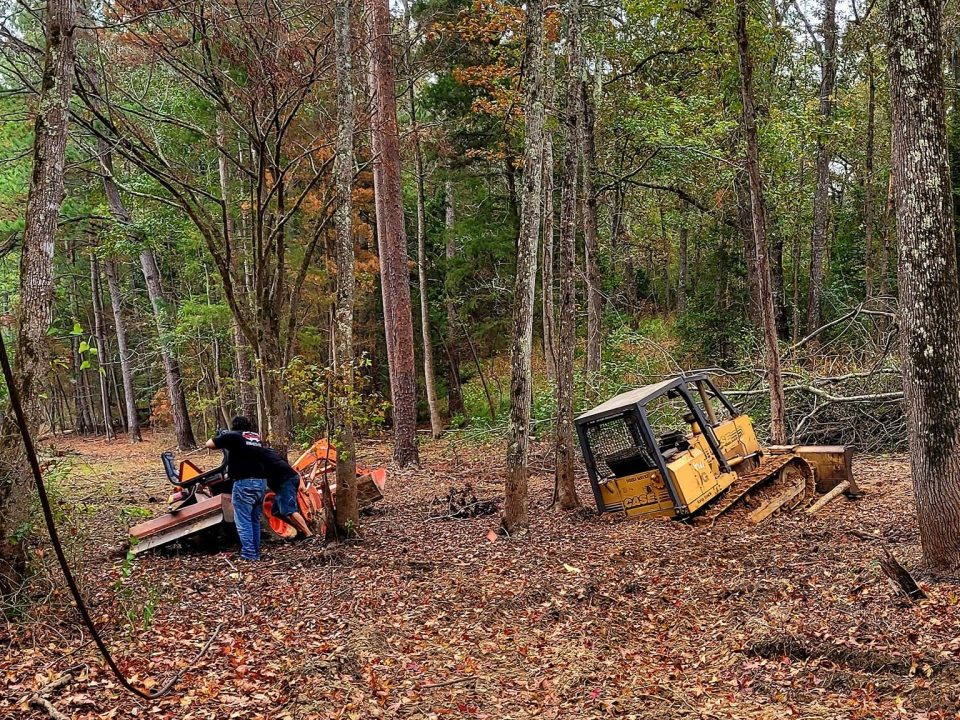 Vehicle recovery service in Palestine TX pulling car from wooded area