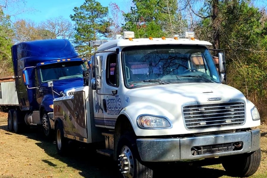 heavy duty truck towing service in Palestine TX hauling pickup and trailer