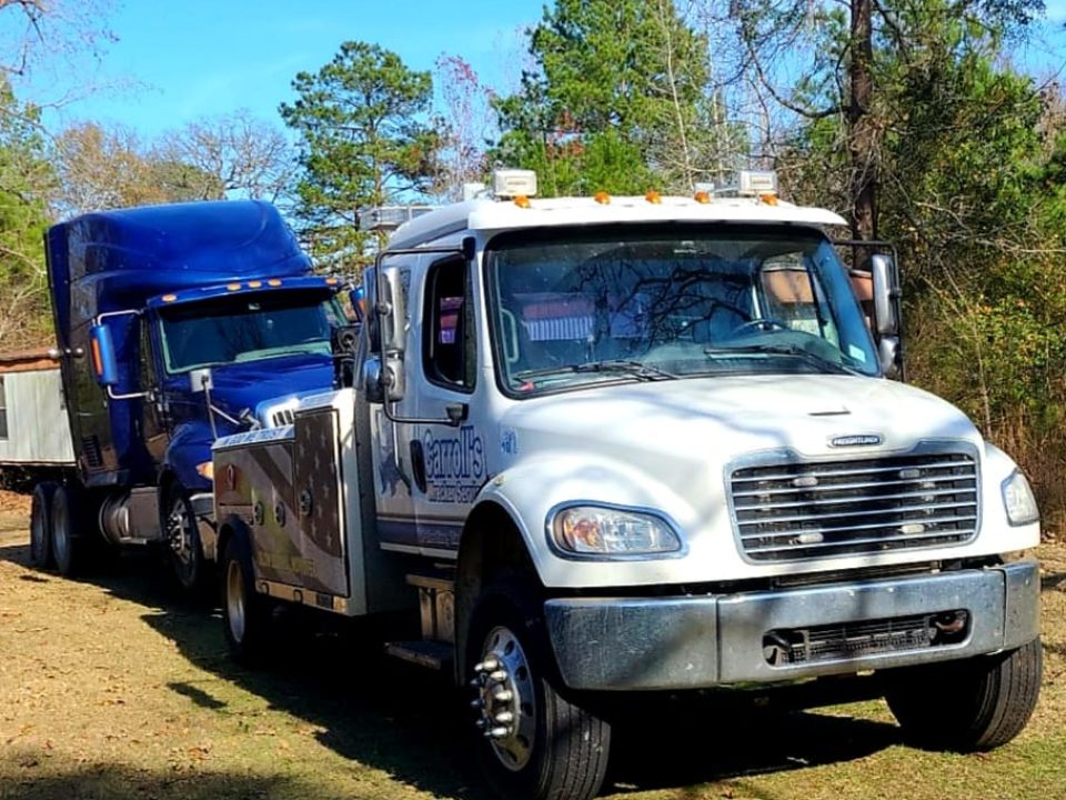 heavy duty truck towing service in Palestine TX hauling pickup and trailer