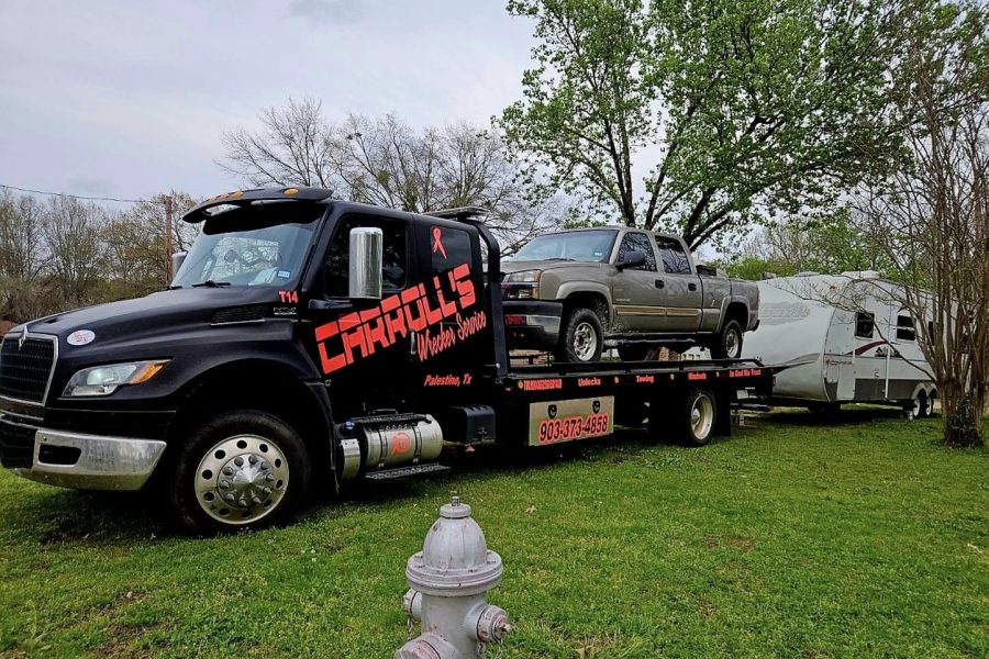 flatbed towing service in Palestine TX transporting pickup truck